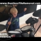 Child playing drums with headphones on.